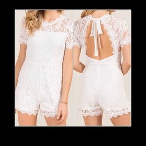 Francesca’s Romy Tie Back Lace Romper, white size medium.